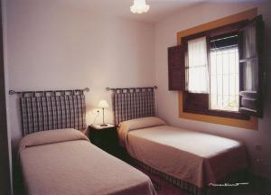 Ein Bett oder Betten in einem Zimmer der Unterkunft La Posada Real