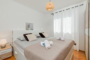 Posteľ alebo postele v izbe v ubytovaní Apartment Soni A4