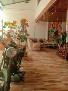 a living room with a motorcycle parked in it at La casa de Goya in Cusco