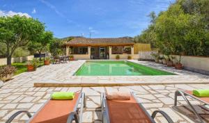 a house with a swimming pool in a yard at Finca Son Cladera Petit in Son Macia