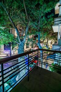 a view of a tree from a balcony at Apartment BİCOCCA in Baku