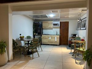 a kitchen and dining room with a table and chairs at Pepe's House Usaquén I Cozy Hotel in Bogotá