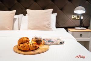 a tray of food on top of a bed at The Segond Hotel in Xagħra