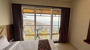Llit o llits en una habitació de 2BHK suite, Panchgani Views, Ora Vue