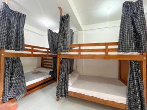 Ένα ή περισσότερα κρεβάτια σε δωμάτιο στο KnowWell Siargao Room 4