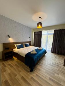 Postel nebo postele na pokoji v ubytování Green Hotel Tskaltubo