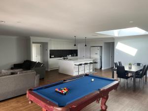 a living room with a pool table in it at Entire 4 bedroom home on Connolly in Bathurst in Kelso