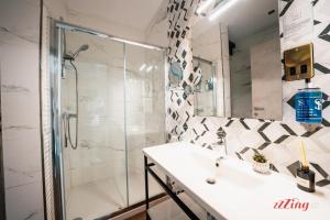a bathroom with a shower and a sink at The Segond Hotel in Xagħra