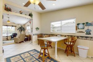 a kitchen with a table and chairs in a room at Paradise Found in Bradenton