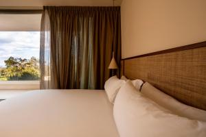 Postel nebo postele na pokoji v ubytování Botanico Villa & Suites