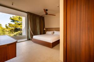Postel nebo postele na pokoji v ubytování Botanico Villa & Suites
