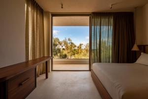 Postel nebo postele na pokoji v ubytování Botanico Villa & Suites
