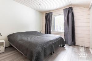 Vuode tai vuoteita majoituspaikassa Holiday in Lapland - Levi Sulkakuja 6 A 15 kuvaa lisää