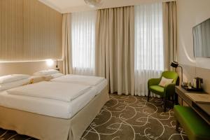 Postel nebo postele na pokoji v ubytování Hotel Erzherzog Rainer