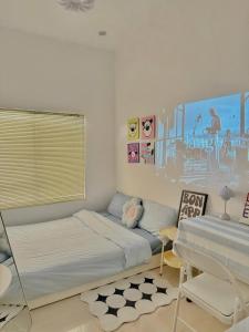 Ein Bett oder Betten in einem Zimmer der Unterkunft Jeju Homestay