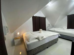 Кровать или кровати в номере Isla Maison Homestay
