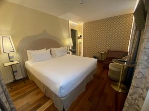 Posteľ alebo postele v izbe v ubytovaní Albergo San Marco