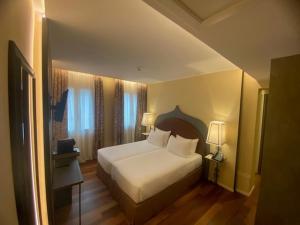 Posteľ alebo postele v izbe v ubytovaní Albergo San Marco