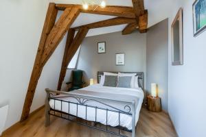 Postel nebo postele na pokoji v ubytování LE RHENANUS Jacques Spiegel - idéal pour un couple - appartement au calme - parking gratuit