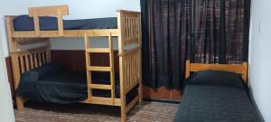 two bunk beds sitting next to each other in a room at temporary rental Mendoza in Guaymallen
