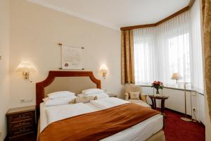 Postel nebo postele na pokoji v ubytování Hotel Erzherzog Rainer