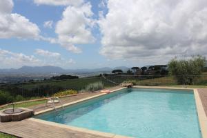 a swimming pool with a view of a mountain at Tenuta San Pietro Luxury Hotel in Lucca