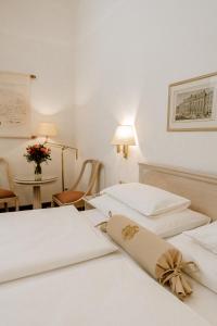 Postel nebo postele na pokoji v ubytování Hotel Erzherzog Rainer + 37 fotografií