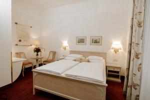 Postel nebo postele na pokoji v ubytování Hotel Erzherzog Rainer