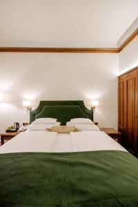 Postel nebo postele na pokoji v ubytování Hotel Erzherzog Rainer