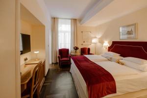 Postel nebo postele na pokoji v ubytování Hotel Erzherzog Rainer