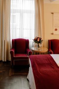 Postel nebo postele na pokoji v ubytování Hotel Erzherzog Rainer