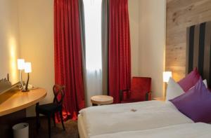 Postel nebo postele na pokoji v ubytování Hotel Post