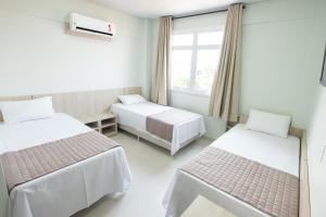 Postel nebo postele na pokoji v ubytování CALLAI HOTEL
