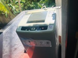 a parking meter sitting on the side of a street at Dinesh House in Weligama