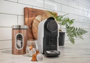 a toaster sitting on top of a kitchen counter at Inner City Location, Modern & Stylish #6 -By KOSH BNB in Hamilton