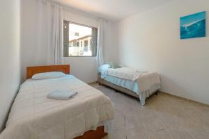Ένα ή περισσότερα κρεβάτια σε δωμάτιο στο Apartamento amplo e confortável em Maringá