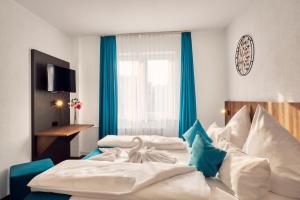Postelja oz. postelje v sobi nastanitve Hotel Hansa Stuttgart City