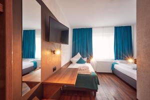 Postelja oz. postelje v sobi nastanitve Hotel Hansa Stuttgart City