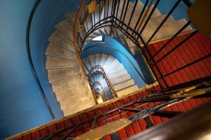 an overhead view of a spiral staircase at Casual Eclettico Milano by Casual Hoteles in Milan +64 photos