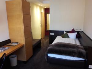 Postel nebo postele na pokoji v ubytování Hotel Post