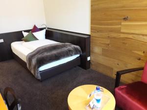Postel nebo postele na pokoji v ubytování Hotel Post