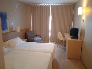 Postel nebo postele na pokoji v ubytování Flag Hotel Valencia - Florazar