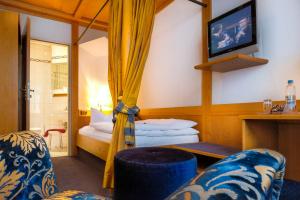 Postel nebo postele na pokoji v ubytování Hotel Post