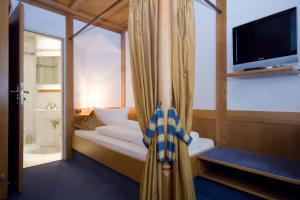 Postel nebo postele na pokoji v ubytování Hotel Post