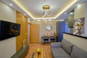 a living room with a couch and a table at Private Apartment at Beylikdüzü nearly to E5 2 in Beylikduzu