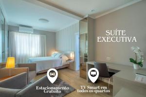 Postel nebo postele na pokoji v ubytování Hotel Glória Blumenau
