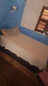 Katil atau katil-katil dalam bilik di Apartamento Para o Carnaval