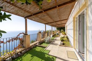 a balcony with a view of the ocean at Tenuta La Picola in Furore