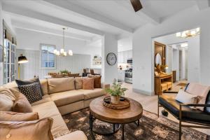 a living room with a couch and a table at Remodeled 1BR Legacy Villa with Private Patio #A in La Quinta