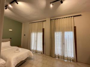 Postel nebo postele na pokoji v ubytování Mamali Guesthouse